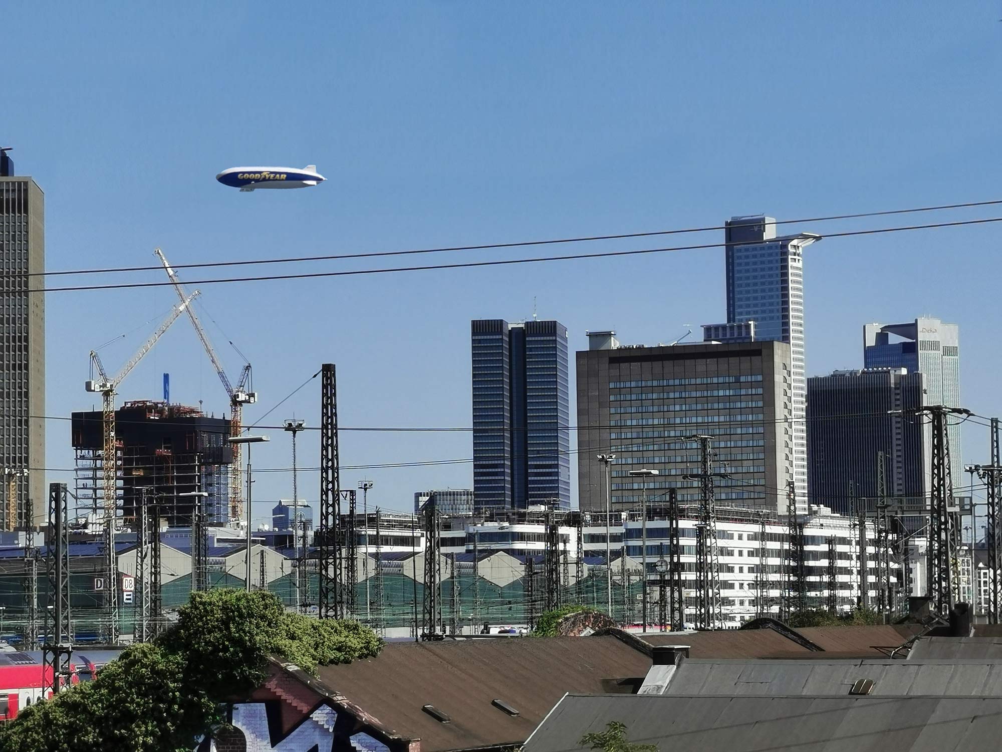 Goodyear blimp over Frankfurt Germany - Zeppelin NT crusing over Frankfurt skyscrapers