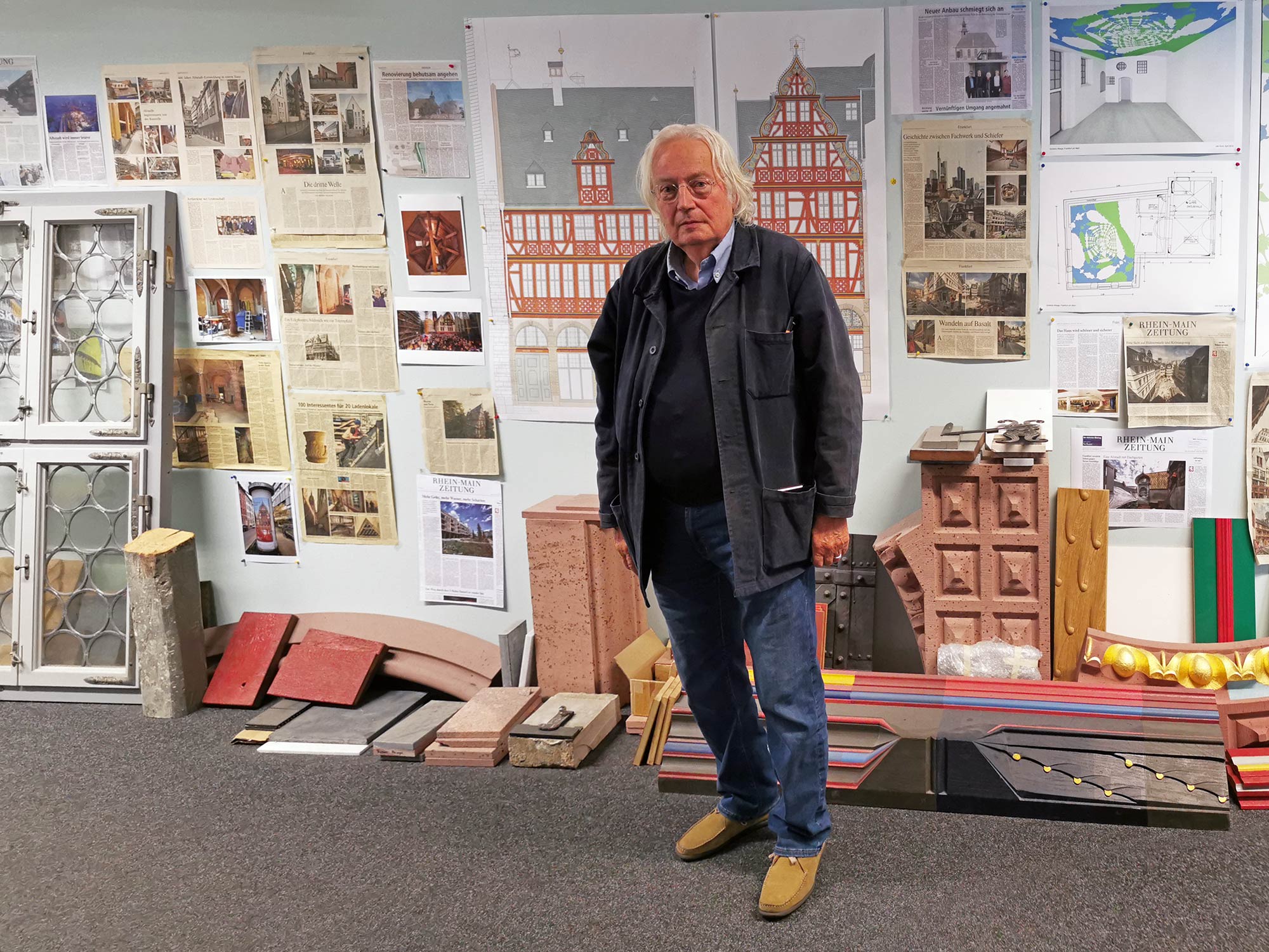 Professor Jochem Jourdan - architect and city planner in Frankfurt - in front of drawings for the Haus zur Goldenen Waage, the most famouse building in Frankfurt's New Old Town