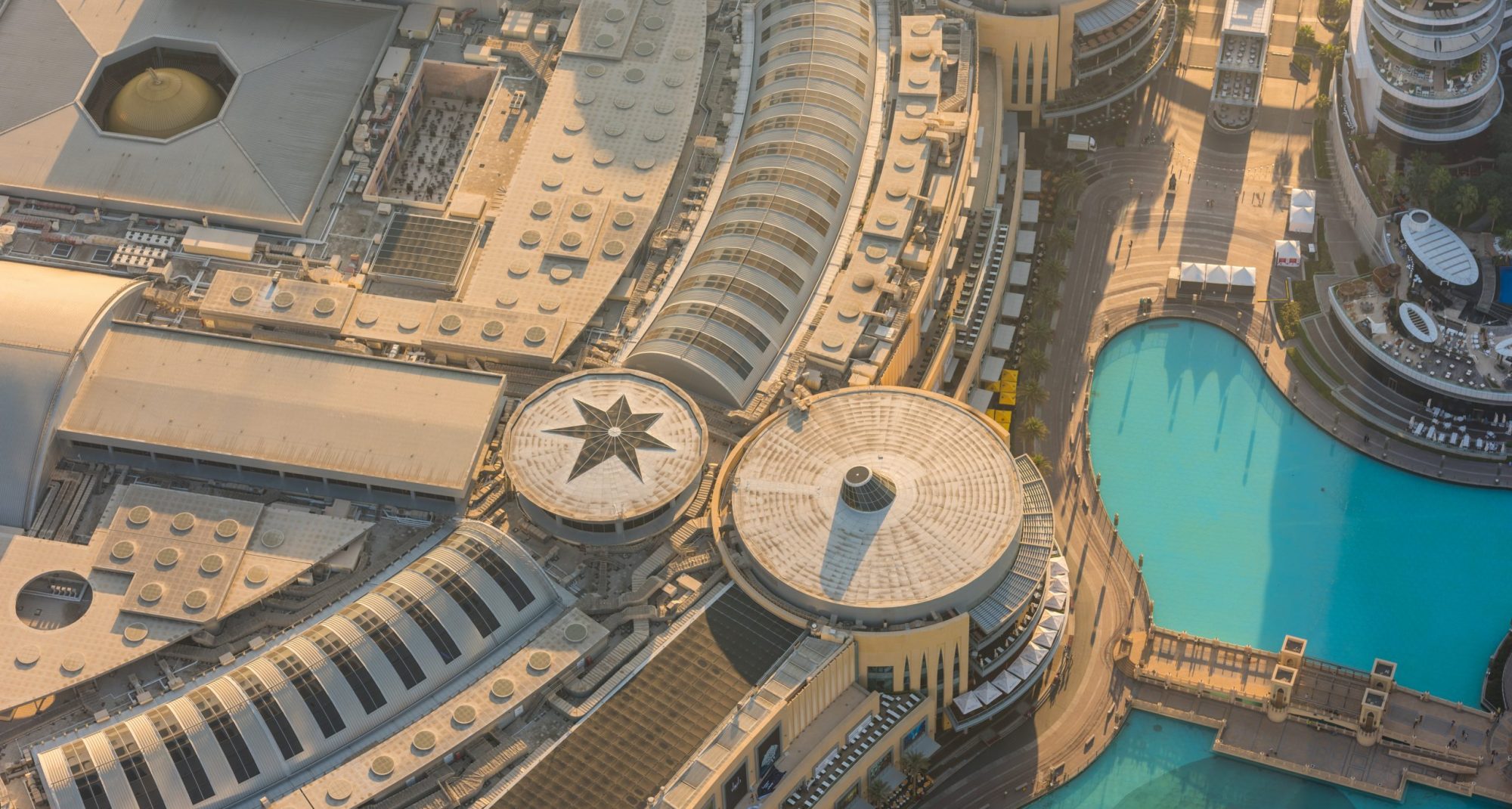 Dubai mall roof golden sunrise morning scene. Top view from above